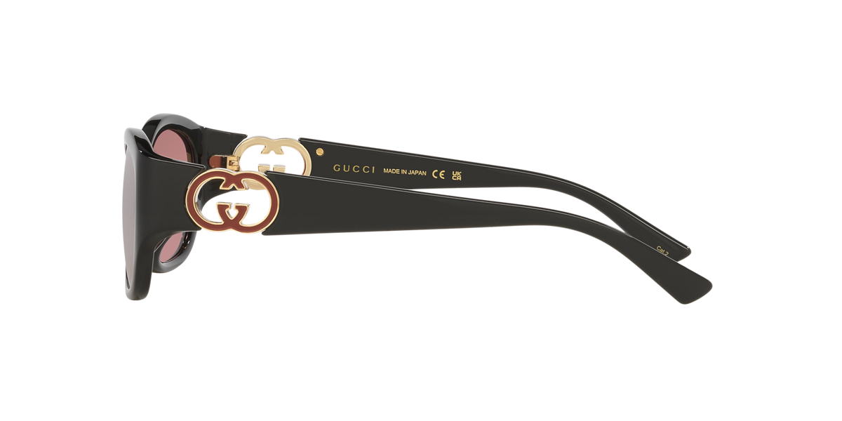 Side view of black Gucci luxury sunglasses with gold double G logo hardware