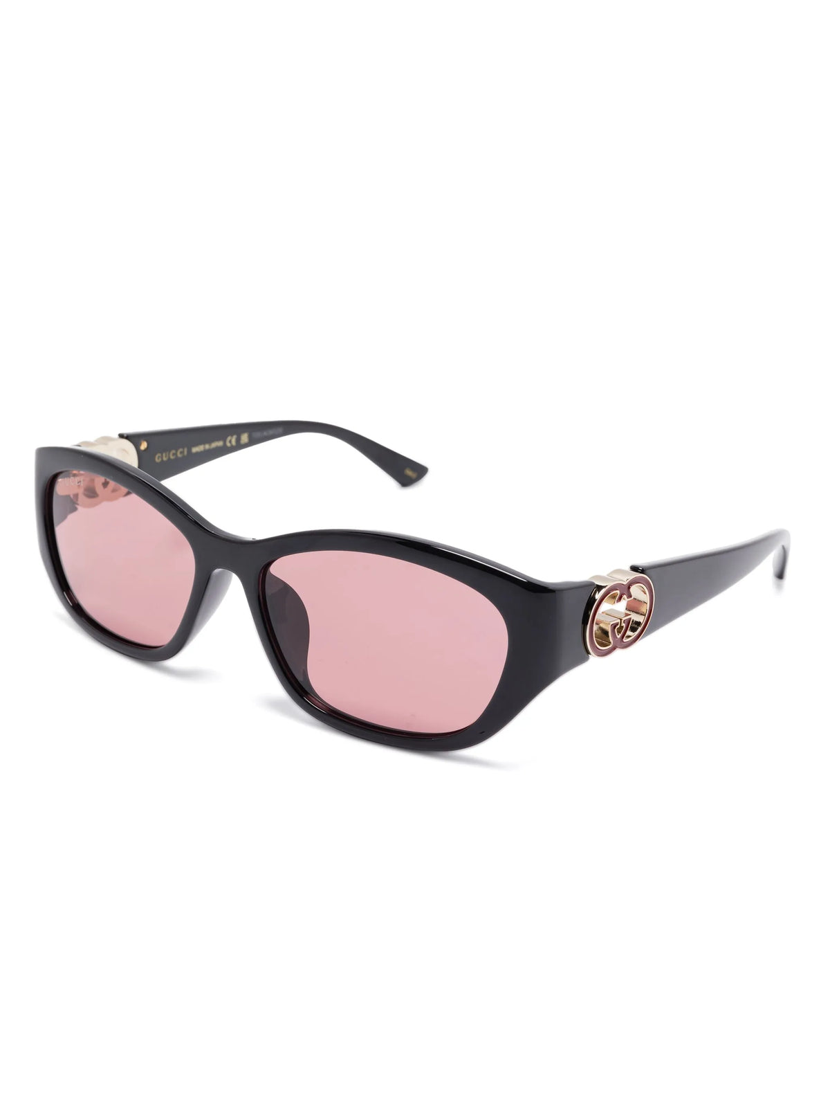 Gucci black luxury sunglasses with pink tinted lenses and gold logo detail