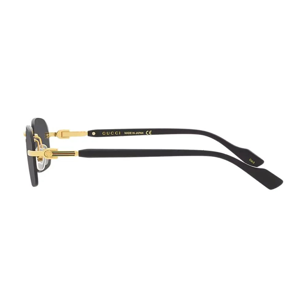 Side view of black Gucci luxury sunglasses with gold-tone metal temples