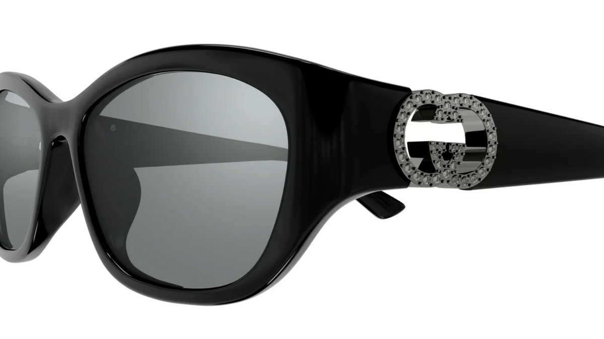 Black luxury oversized sunglasses with sparkling rhinestone embellished temples.